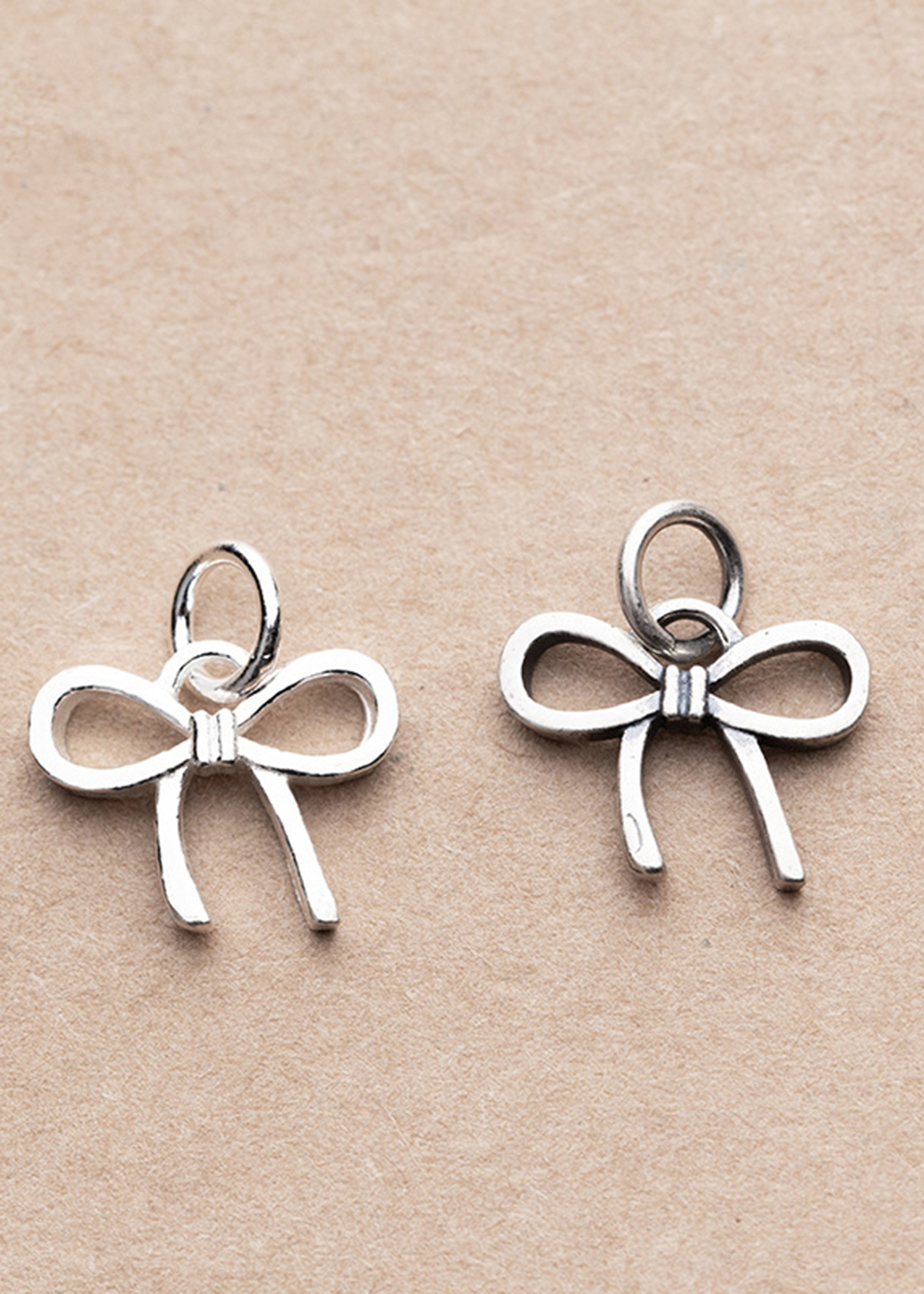 Combo 2 cái charm bạc hình nơ mặt treo - Ngọc Quý Gemstones