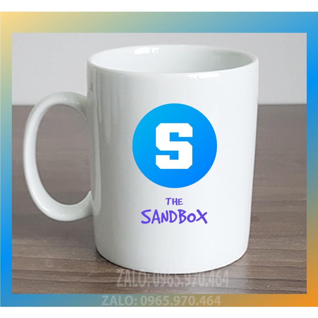 Ly Sứ Có Quai Họa Tiết Đồng Coin THE SANDBOX - In hình lên ly sứ, cốc theo yêu cầu của bạn - HÌNH LỚP, CÔNG TY