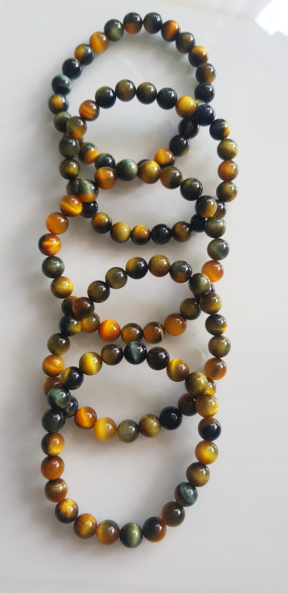 Vòng tay phong thủy may mắn Nữ đá mắt hổ tự nhiên vàng xanh đều mới bóng mượt đẹp Size hạt 8mm Nữ đeo Công dụng vòng đá mắt hổ đá thiên nhiên tốt cho sức khỏe, đem đến may mắn,xoa dịu tâm trí công việc hanh thông ạ