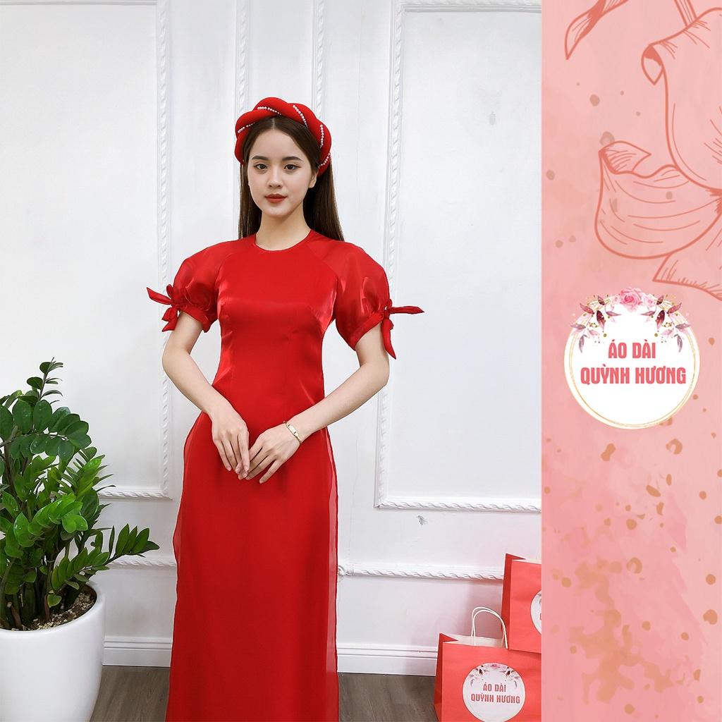 Áo dài màu đỏ chất voan tơ tay bồng buộc nơ cổ tròn