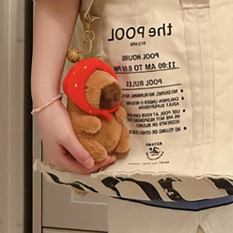 Móc khoá Capybara 12 cm vô tri hài hước, thú nhồi bông chuột lang nhiều mẫu mã đeo balo, đội mũ dâu, gấu bông Capybara có tóc Hồng Nâu
