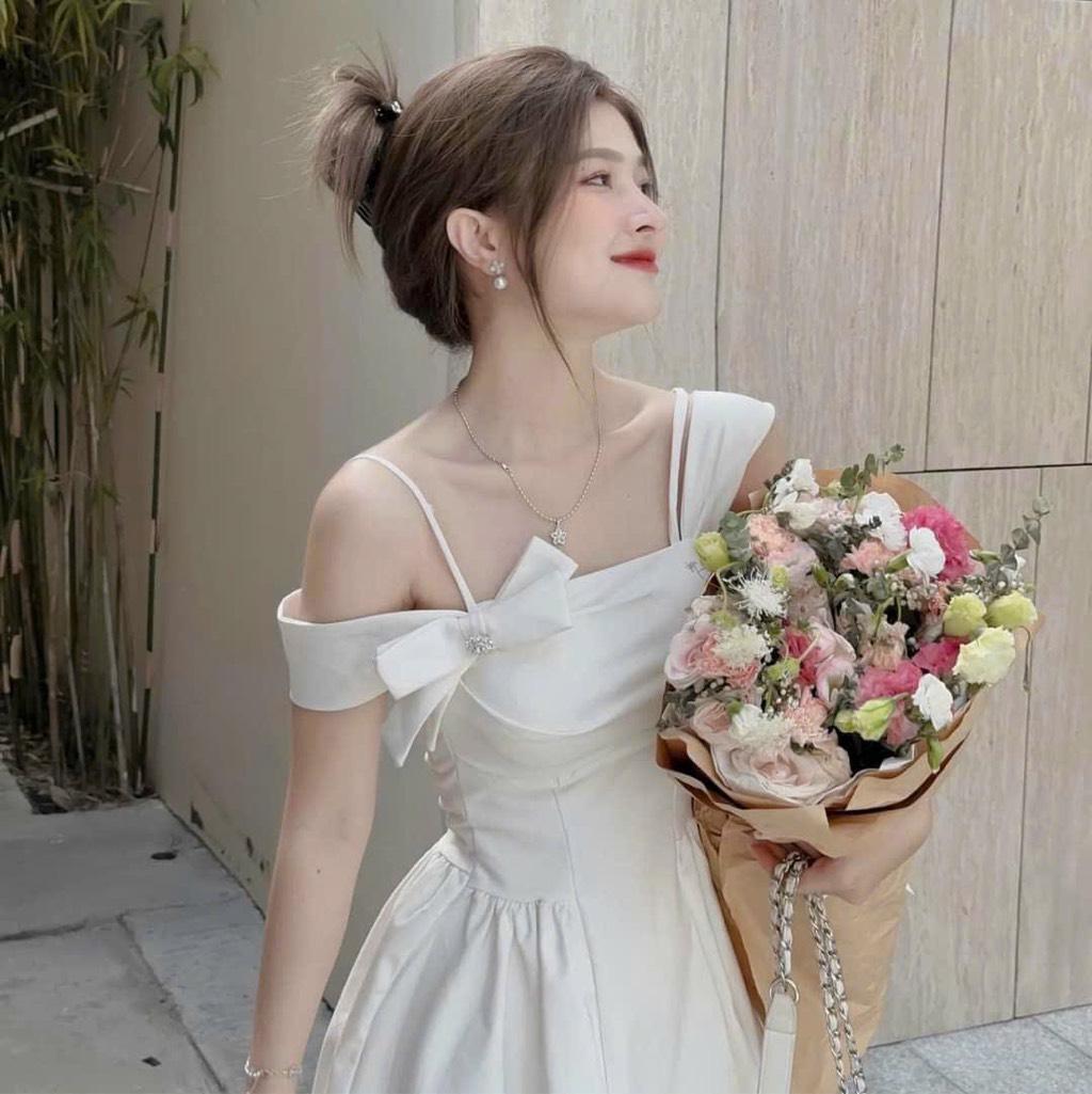 Đầm xòe lệch vai đính nơ