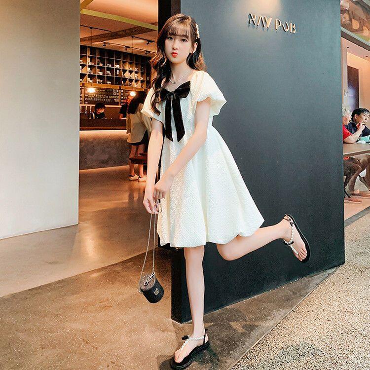 DONGSHOP HOT Cô gái bong bóng nước ngoài tay áo đầm mùa hè 2023 Hàn Quốc trẻ em Bowknot váy công chúa váy mùa hè