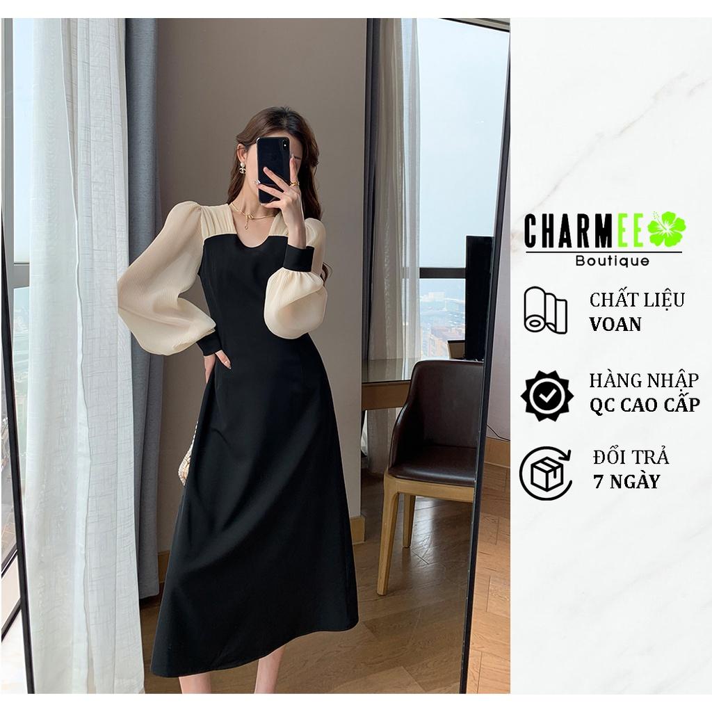 Đầm đen tay kem cổ tròn