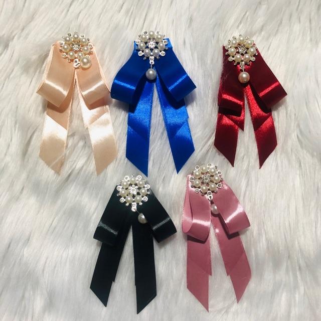 Cài áo nơ. KT 7 x 14cm. Có nhiều màu