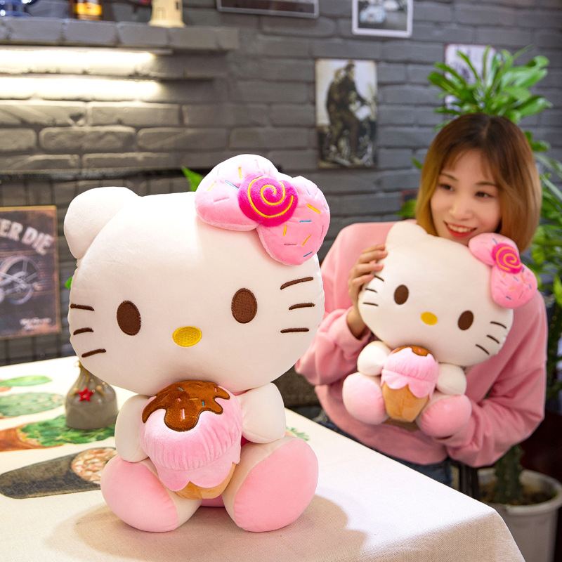 Gấu bông Hello Kitty ôm bánh đeo nơ dễ thương cho bé kích thước 30-40-55cm