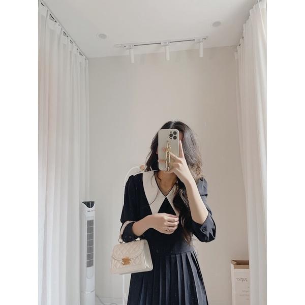 Váy xếp ly dưới cổ trắng