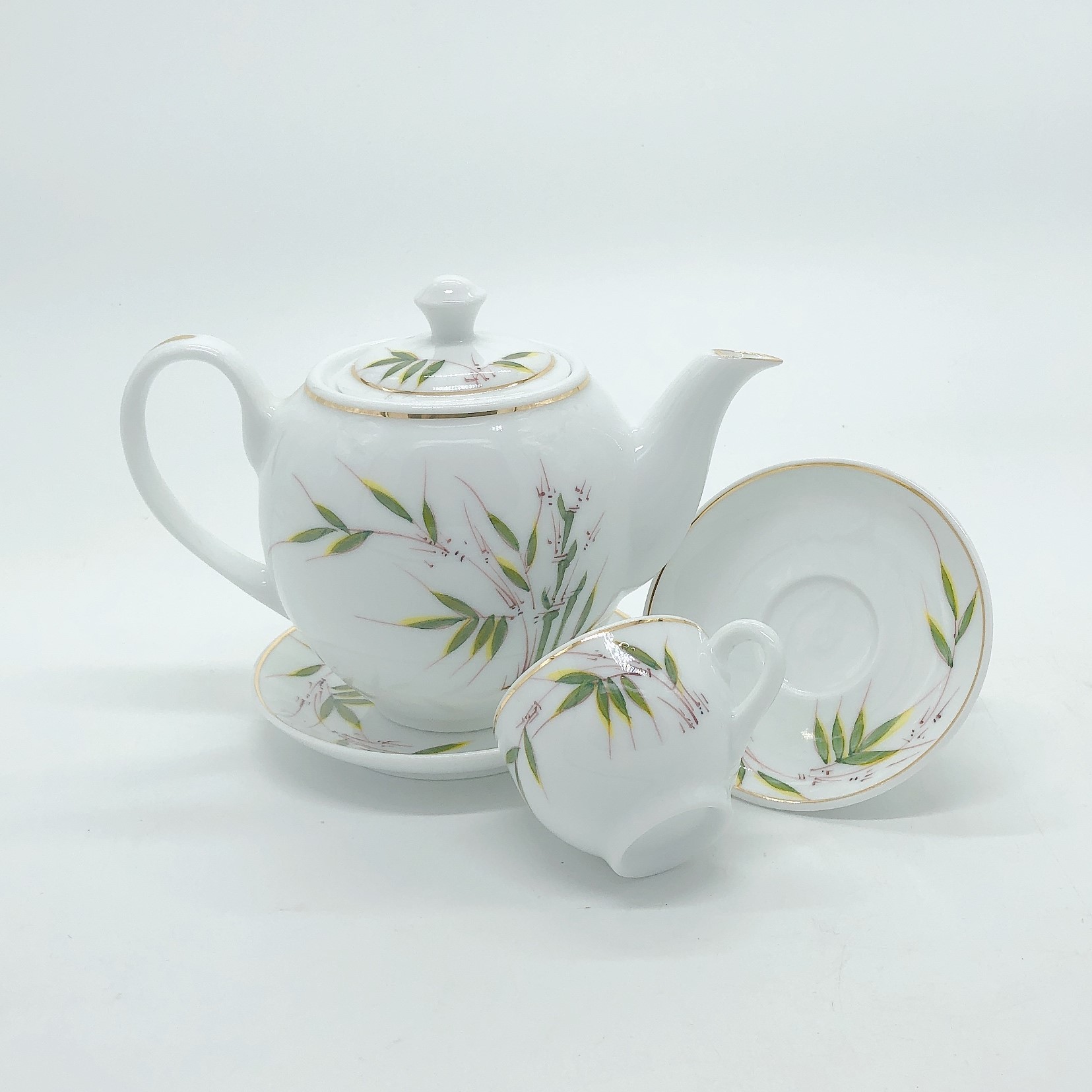 Bộ ấm chén / Bộ bình men trắng trong vẽ lá trúc - đánh chỉ viền vàng kim