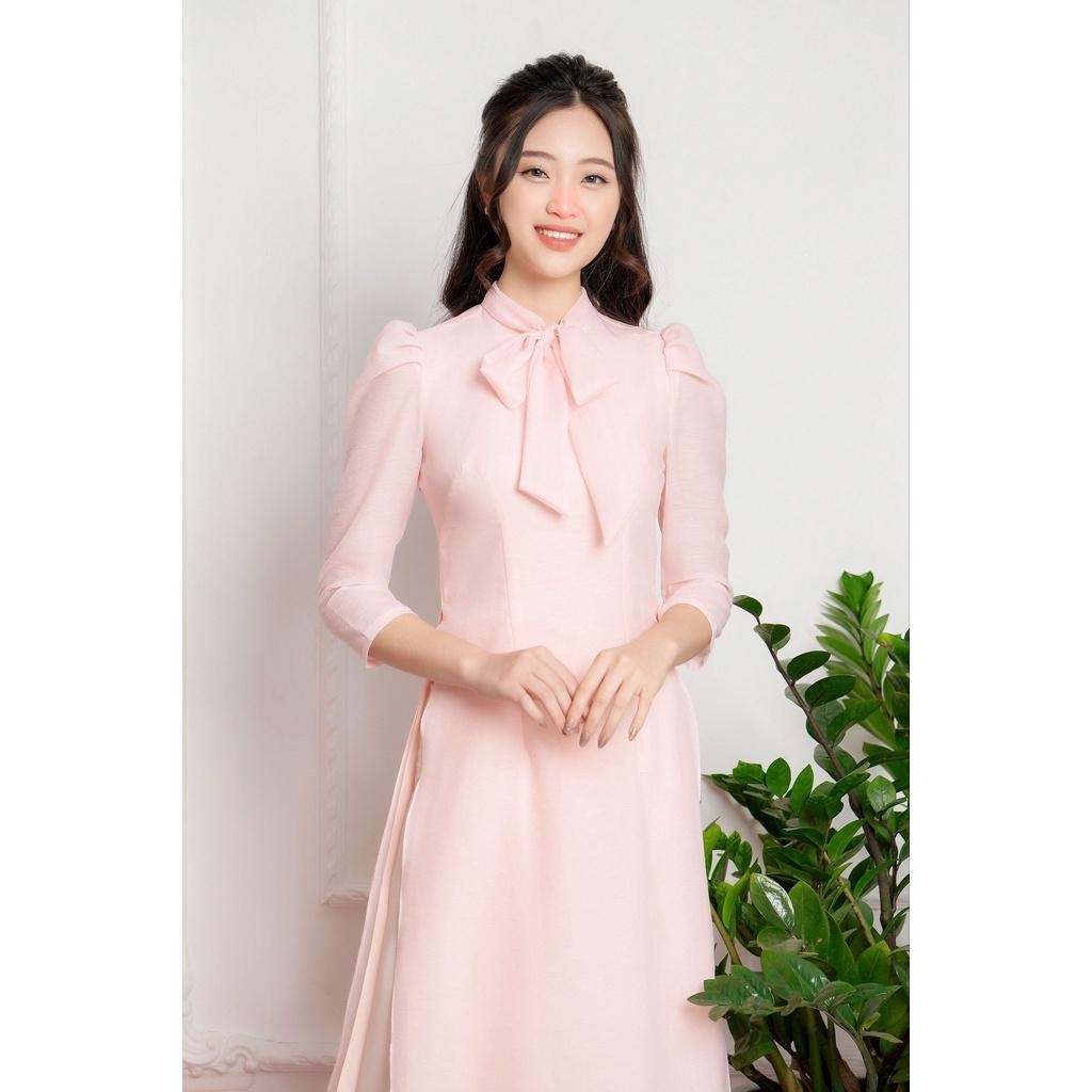 Áo dài hồng cách tân buộc nơ cổ điệu đà chất tơ đũi siêu mát