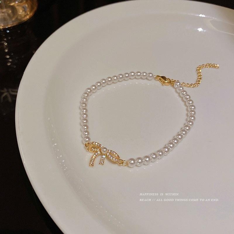 Lắc tay vòng tay nữ titan không gỉ mặt nơ phối hạt trai đẹp sang Ring House