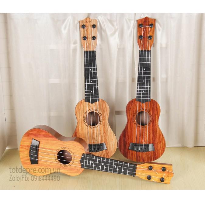 Đồ chơi đàn guitar mini vân gỗ cho trẻ tập chơi đàn