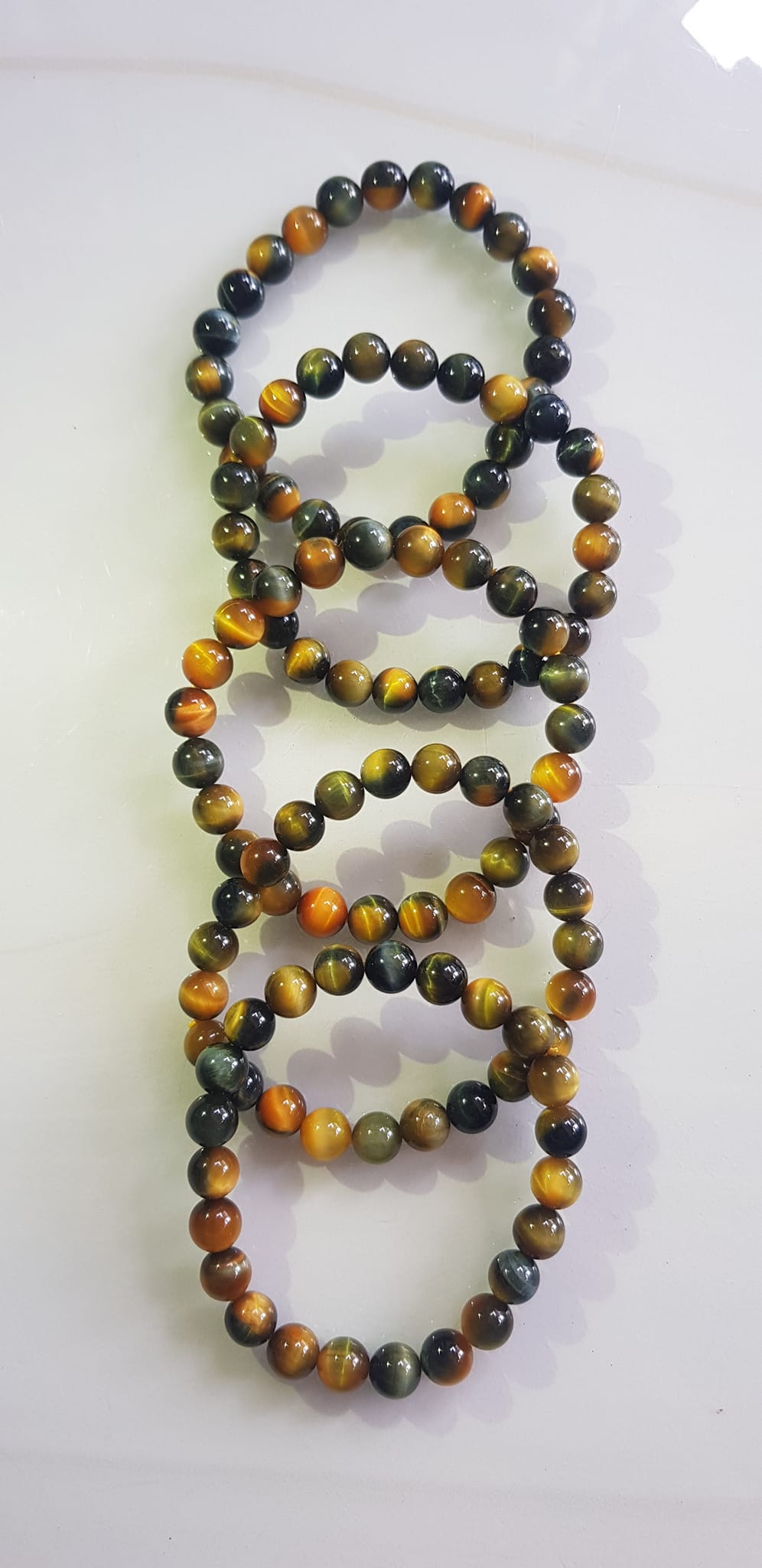 Vòng tay phong thủy may mắn Nữ đá mắt hổ tự nhiên vàng xanh đều mới bóng mượt đẹp Size hạt 8mm Nữ đeo Công dụng vòng đá mắt hổ đá thiên nhiên tốt cho sức khỏe, đem đến may mắn,xoa dịu tâm trí công việc hanh thông ạ