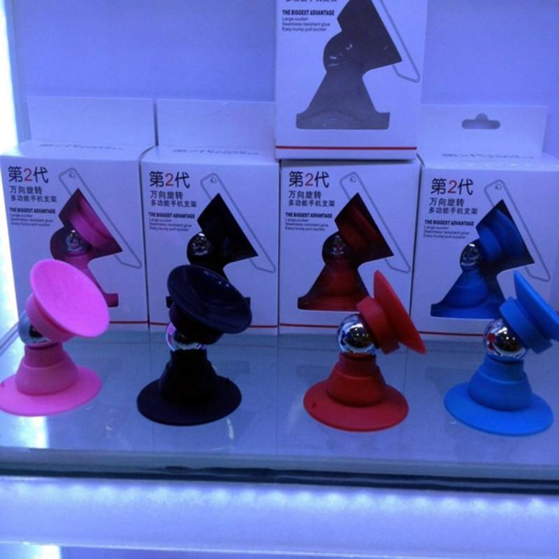 Phong cách mới nhất xe nam châm giá đỡ điện thoại di động nói chung xe silicone hai mặt cốc hút loại giá đỡ điện thoại di động lười biếng giá đỡ máy tính để bàn