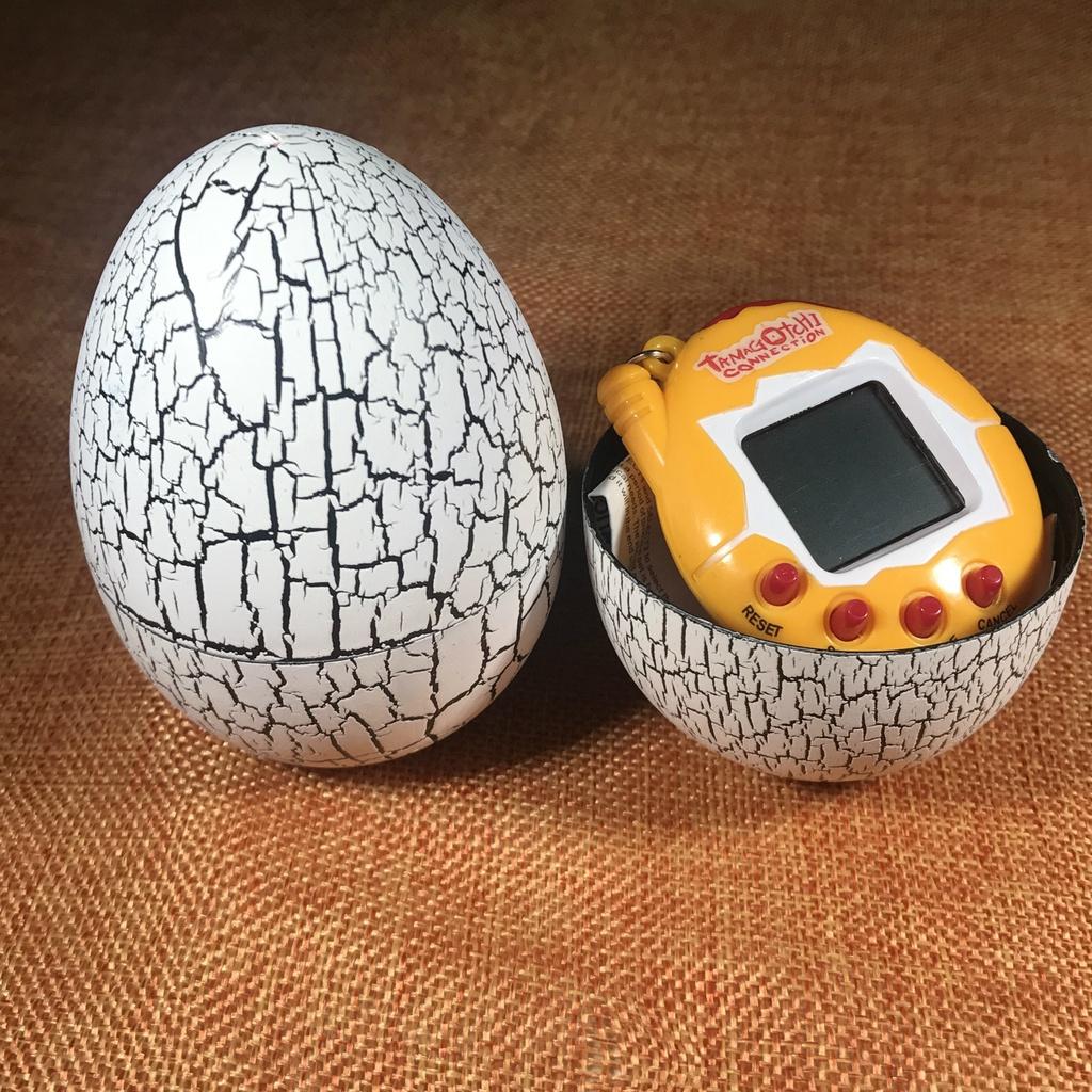 Máy nuôi thú ảo Tamagotchi kèm vỏ trứng độc đáo Nằm Trong Vỏ Quả Trứng