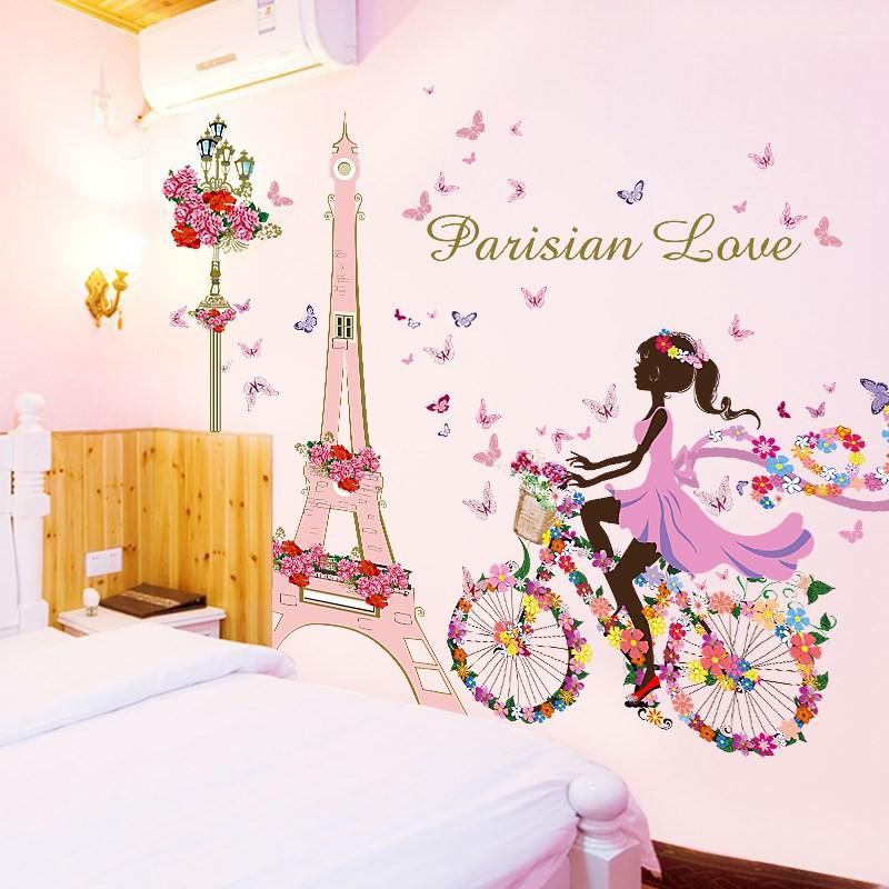 Decal dán tường cô gái đạp xe bên tháp