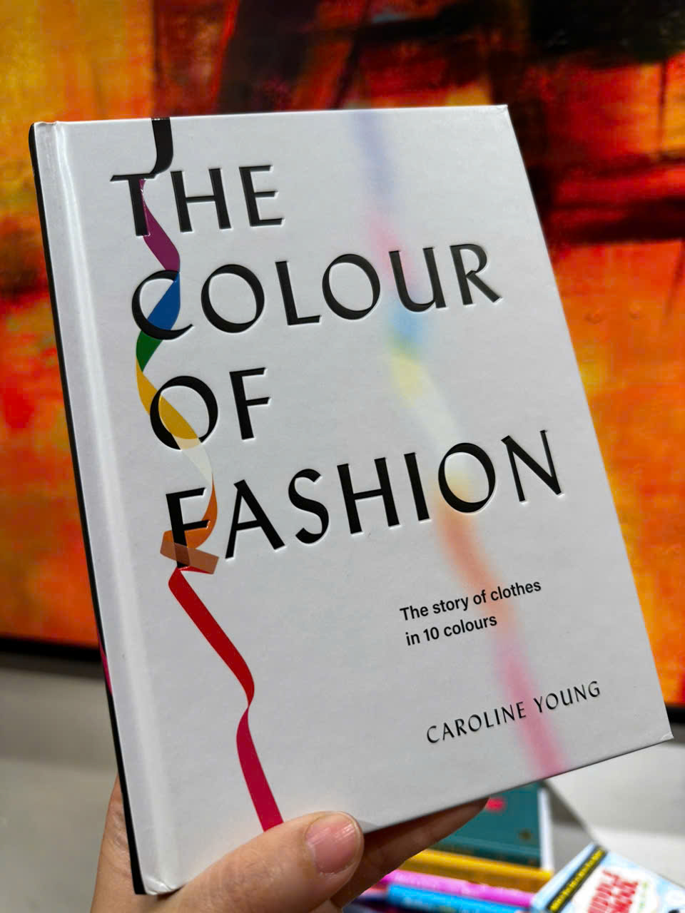 Sách - The Colour of Fashion: The Story of Clothes in Ten Colours by Caroline Young - Sách nghệ thuật, tiếng anh