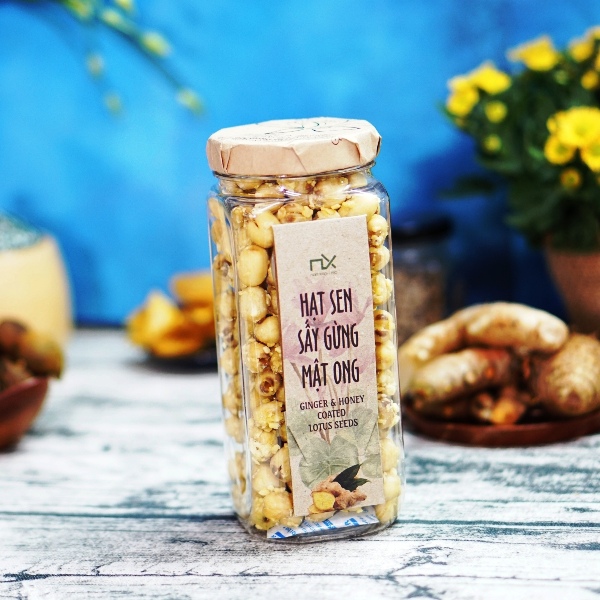 Túi  quà gồm Tắc sấy dẻo 140g/160g  và Hạt sen sấy gừng mật ong 200g/250g Nam Xanh