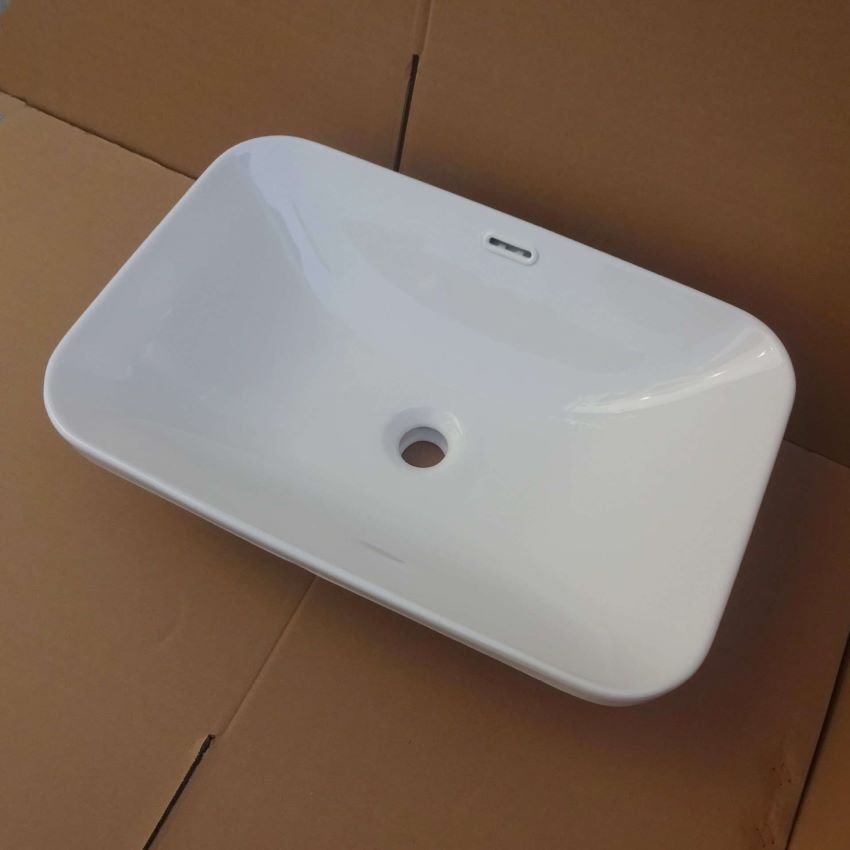 Chậu lavabo bằng sứ bán âm màu trắng hình chữ nhật