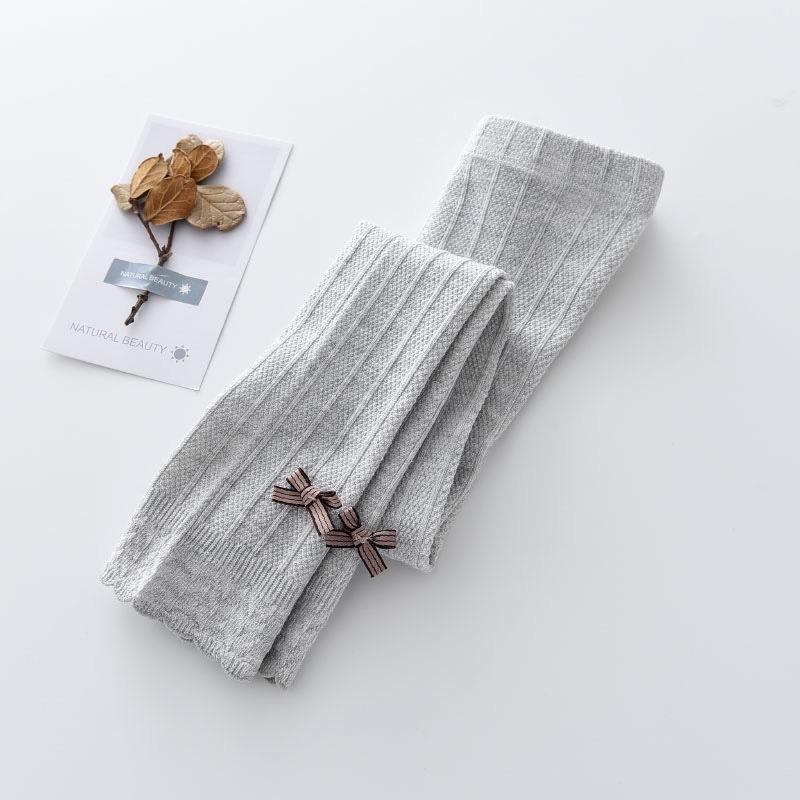 Quần tất len không bàn - quần leggings đính nơ trơn màu cho bé gái, co giãn 4 chiều size từ 1 đến 12 tuổi