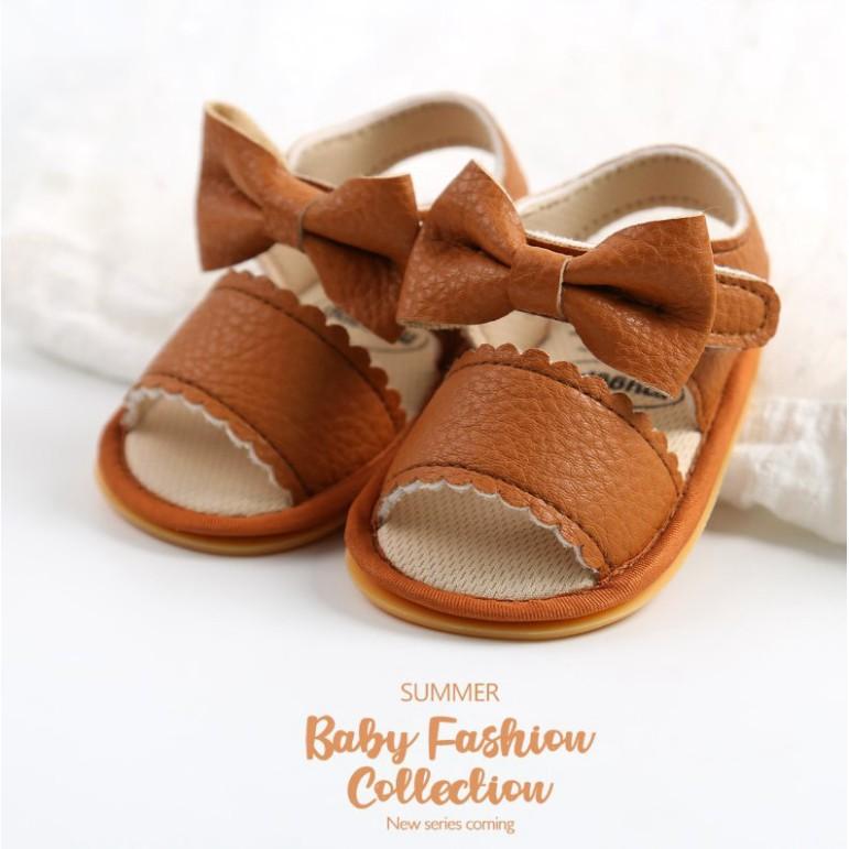 Giày sandal tập đi cho bé đế cao su chống trơn trượt chất da mềm cực chất đính nơ dễ thương cho b