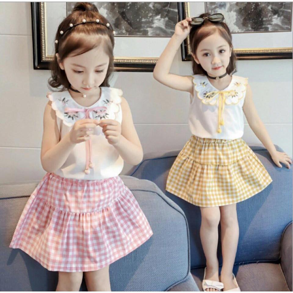 SÉT ÁO CỘT NƠ PHỐI CHÂN VÁY