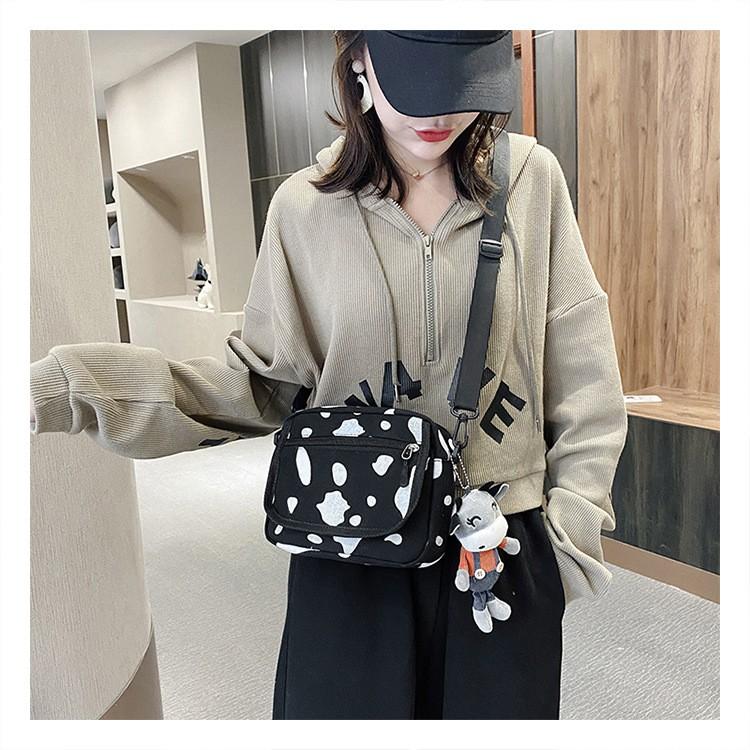 TÚI ĐEO CHÉO NAM NỮ HỌA TIẾT BÒ SỮA