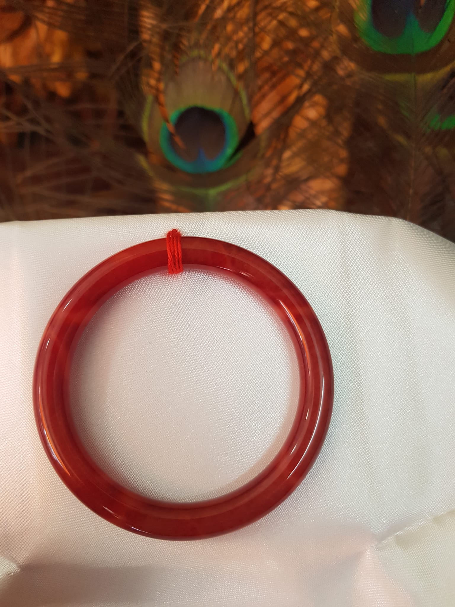 Vòng Nữ đá cẩm thạch Đỏ Đẹp 50mm x cọng 7,2mn Màu đỏ đậm vân vân đậm nhạt đều đẹp Nữ mệnh Hỏa Thổ 49kg - 54kg ạ