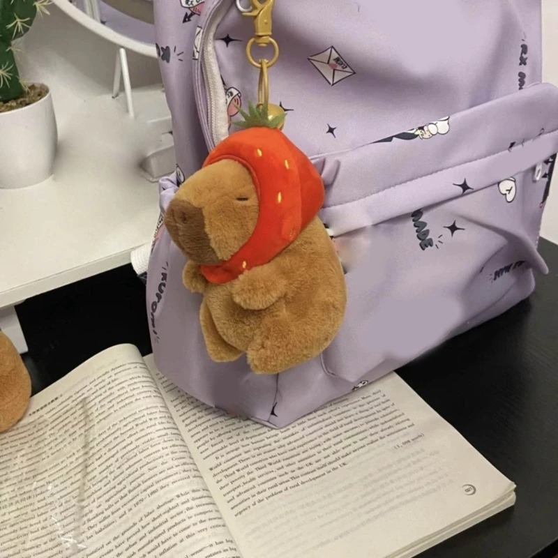 Móc khoá Capybara 12 cm vô tri hài hước, thú nhồi bông chuột lang nhiều mẫu mã đeo balo, đội mũ dâu, gấu bông Capybara có tóc Hồng Nâu