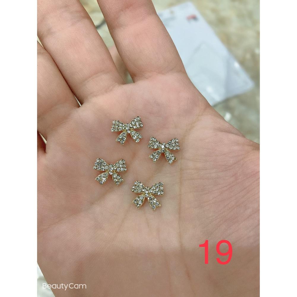 charm nơ mã 19 trang trí nail