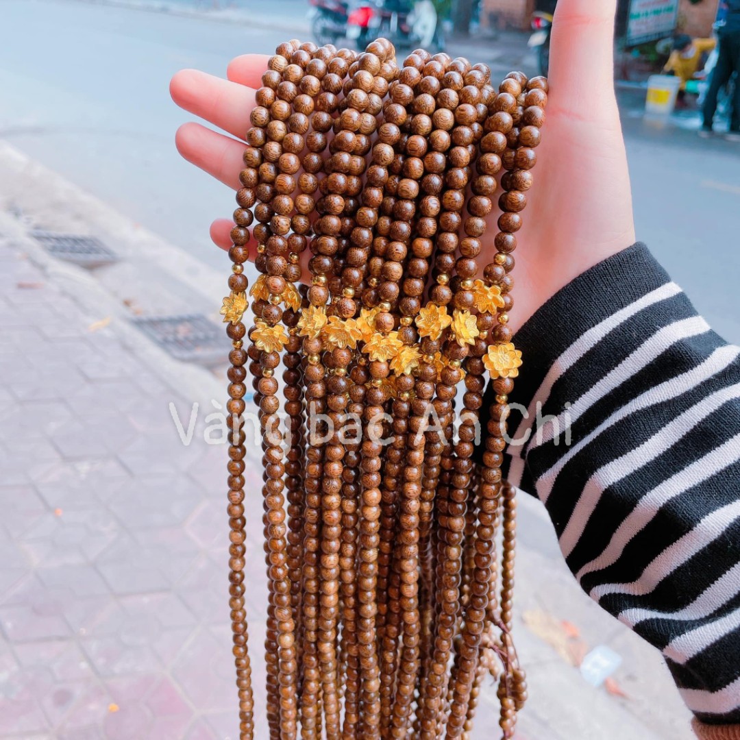 Chuỗi vòng tay trầm 108 hạt mix charm hoa sen bạc xi vàng 24k may mắn bình an Vàng bạc an chi