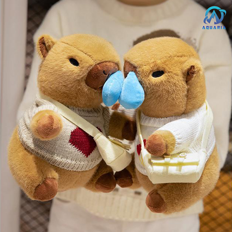 Gấu Bông Thú Nhồi Bông Capybara Mặc Áo Len Đeo Túi Có Thể Kéo Mũi Siêu Đáng Yêu 25cm (Mẫu Áo Len Ngẫu Nhiên)