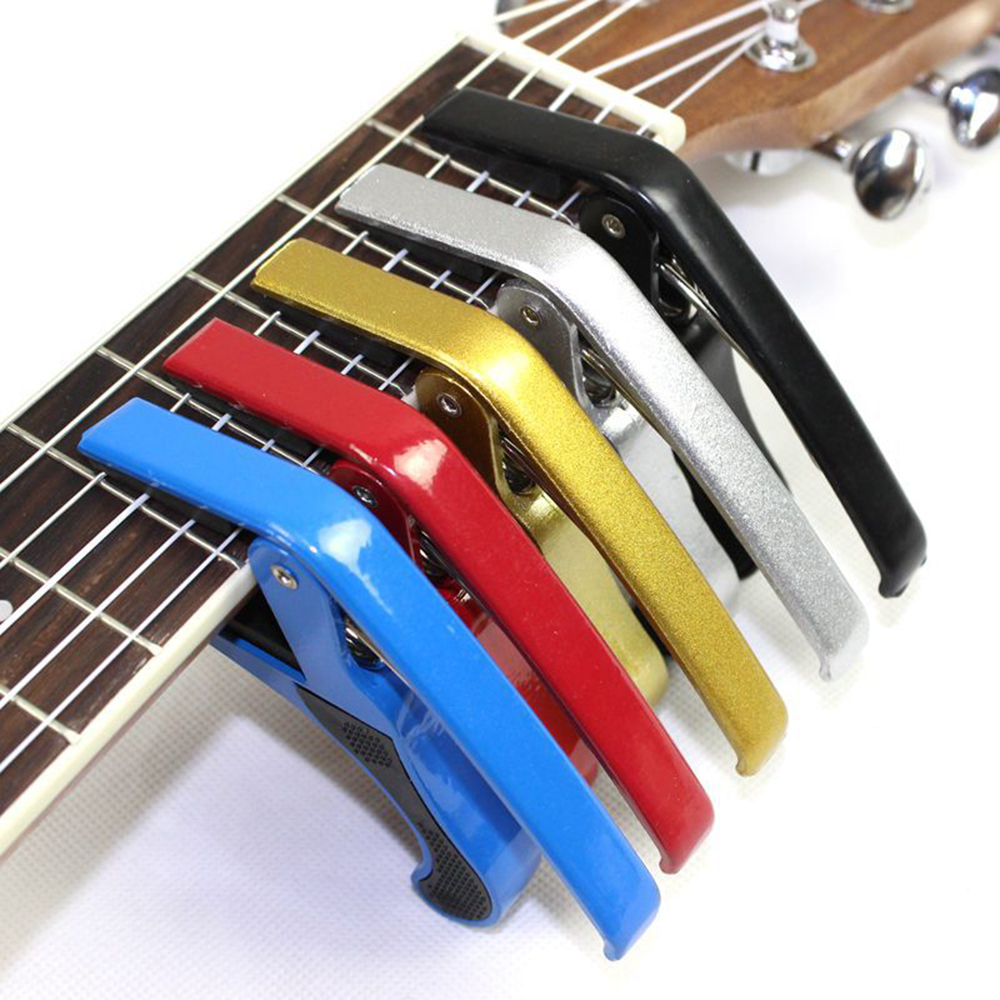 Kẹp capo guitar CP1 dùng cho đàn guitar acoustic và có thể cho classic ở các ngăn đầu tặng kèm pick gải đàn