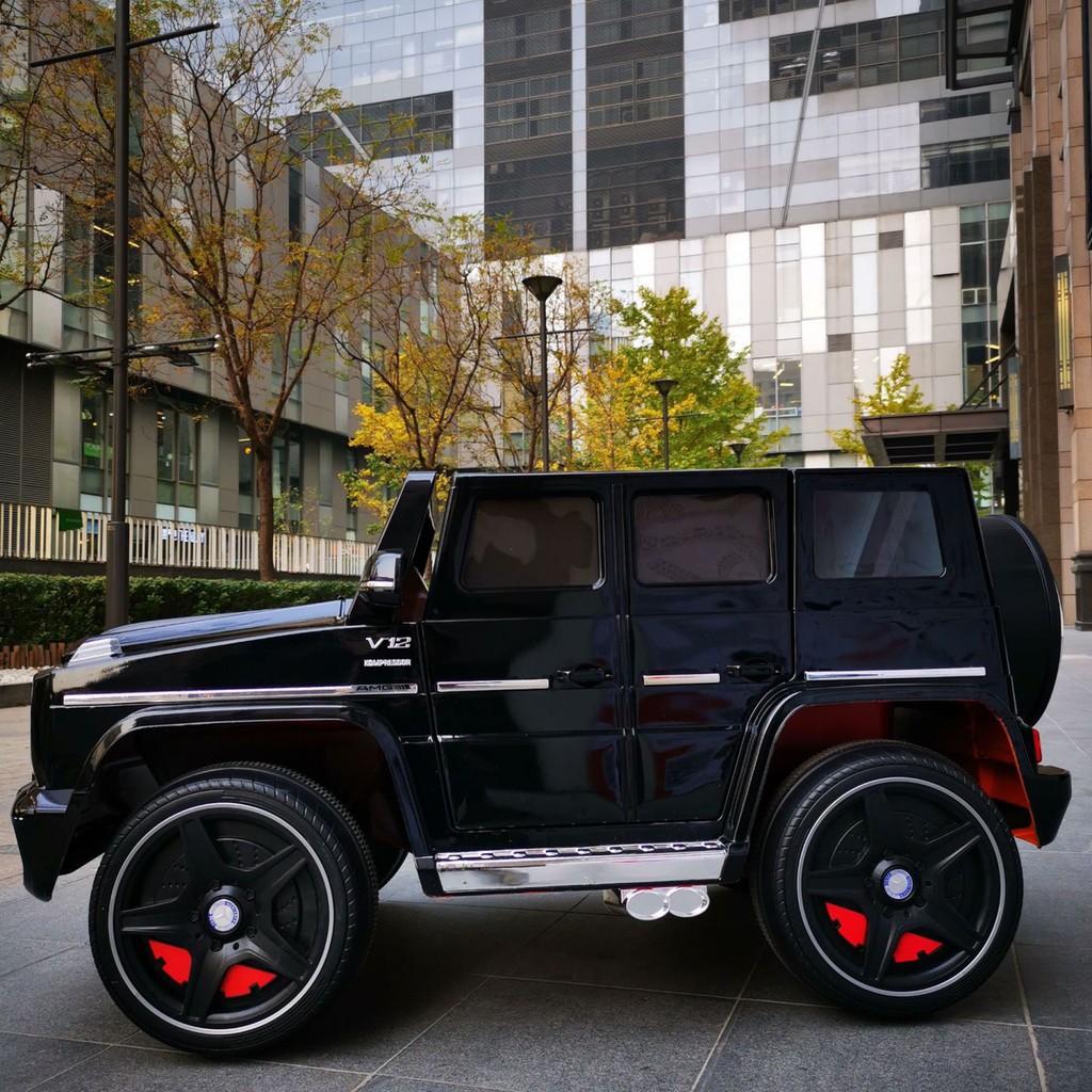 Ô tô xe điện MERCEDES G65 đồ chơi vận động cho bé ghế da 2 chỗ 4 động cơ (Đen-Đỏ-Trắng)