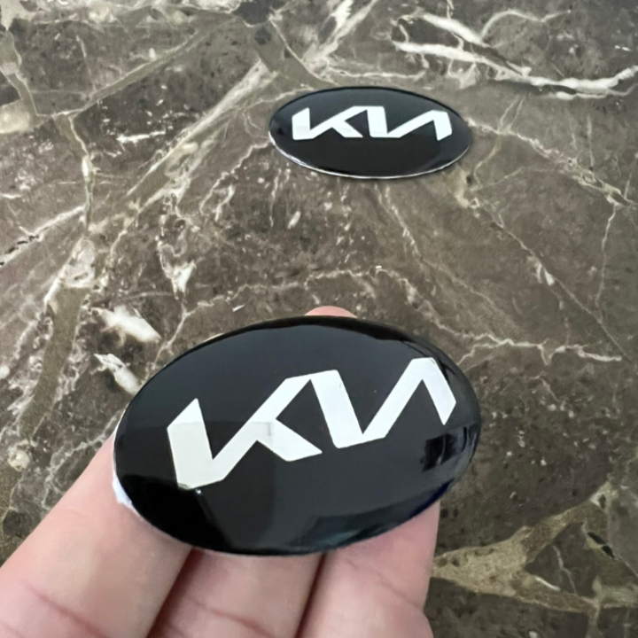Logo biểu tượng vô lăng xe ô tô KIA, kích thước 60x30mm