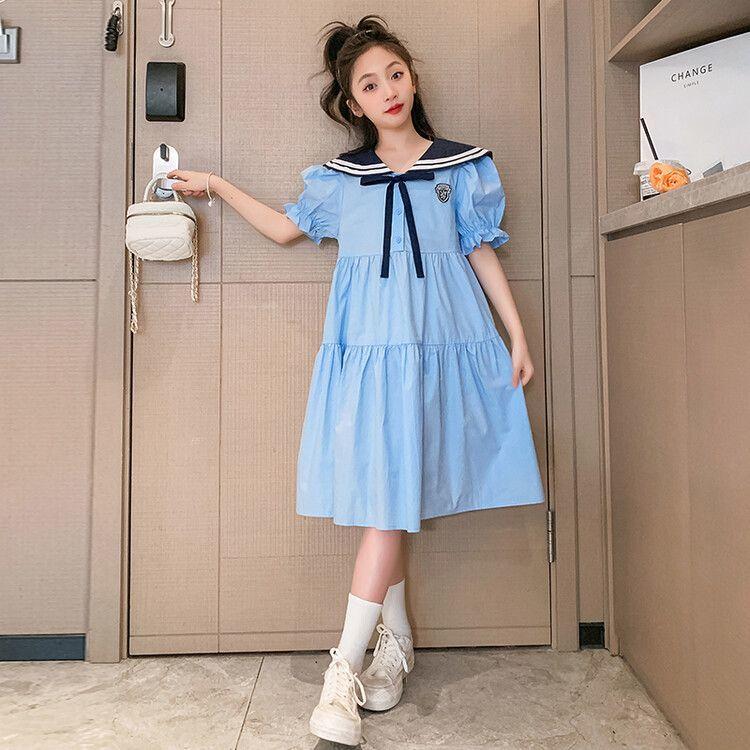 DONGSHOP Cô gái mùa hè ăn mặc 2023 mùa hè trẻ em gái trung bình bé lớn lỏng lẻo Hàn Quốc đại học gió ăn mặc