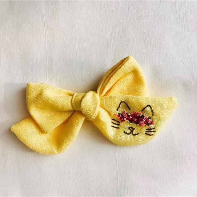 Nơ mặt mèo linen màu vàng siêu đáng yêu