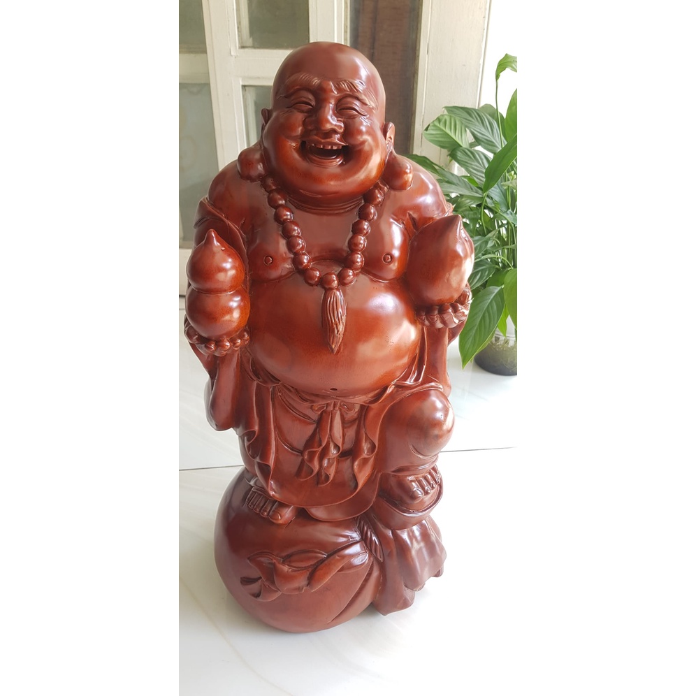 Tượng Di Lặc Đứng bao tiền to tay cầm hồ lô và quả đào cười tươi vui vẻ Cao 50cm x ngang 22cm x Sâu 19cm chất liệu gỗ gõ mật Anh Chị trưng phòng khách nhà, công ty, Cửa Hàng, trên bàn thờ Thần Tài đẹp may mắn, vui vẻ tài Lộc cả năm nhe ạ
