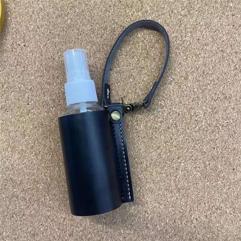 Portable 60ml Spray Bottle with Cover Empty Plastic Refillable Travel Mister Bottle with Leather Keychain Holder