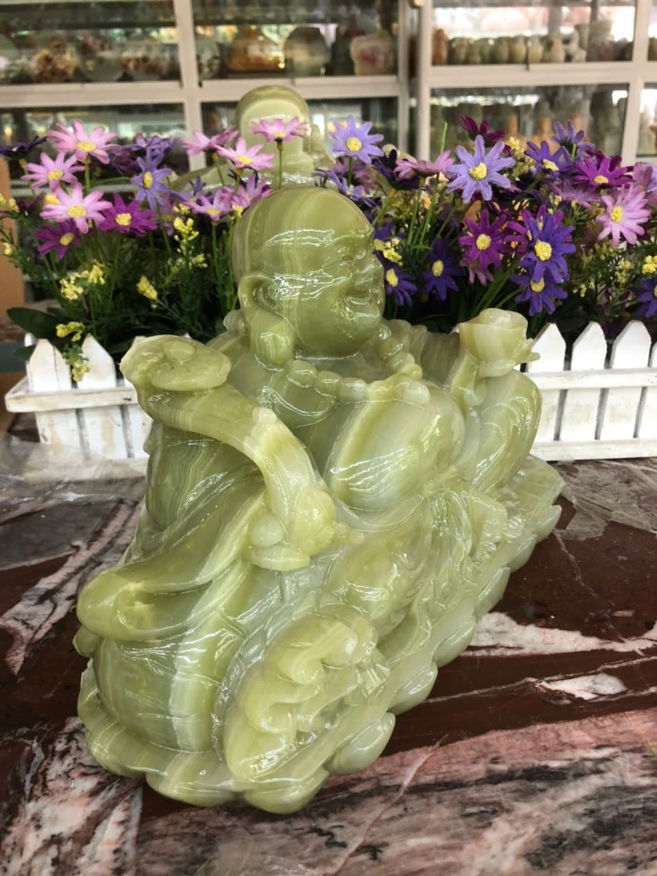Tượng Phật Di Lặc ngồi tựa bao tiền cầm thỏi vàng phong thủy đá ngọc onyx