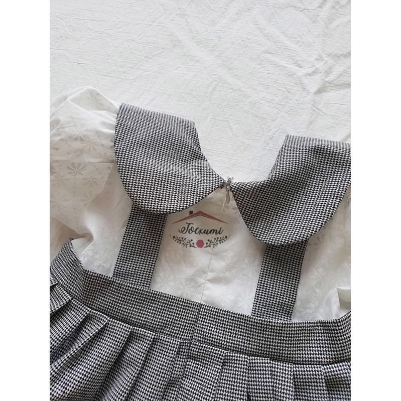 VÁY CARO ĐEN BÈO TRẮNG