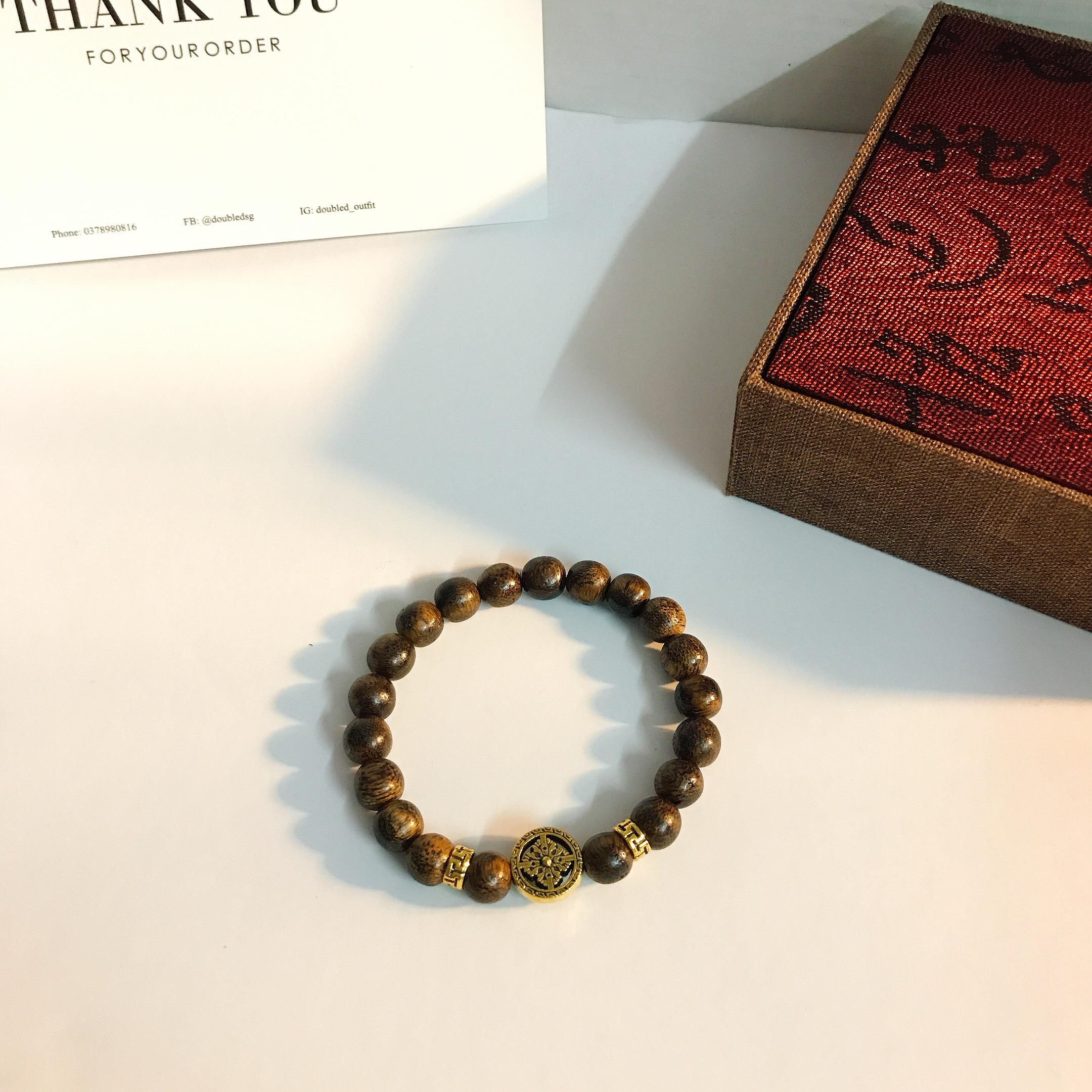 Vòng tay trầm hương pháp luân mạ vàng 18k