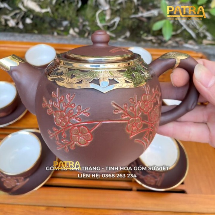 Bộ ấm chén uống trà cao cấp , bộ ấm trà Bát Tràng - trường sa nhật nguyệt khác đào hoa bọc đồng trắng