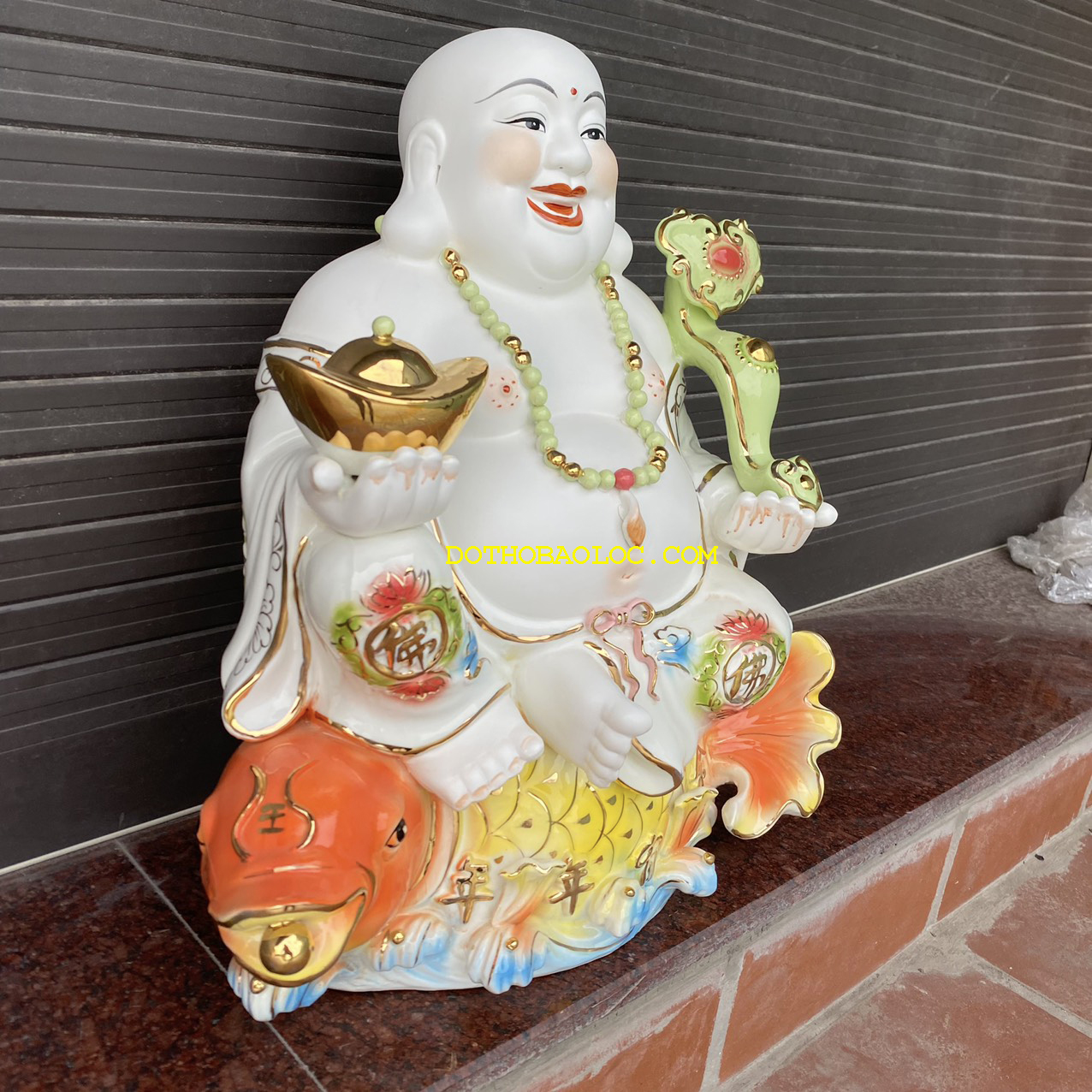 Tượng Di Lặc men sứ ngồi trên cá chép hóa rồng cao 50cm