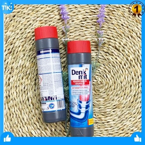 Bột thông cống Denkmit Rohrreiniger Granulat, 600 g loại bỏ tác nhân cứng đầu gây tắc nghẽn ống bởi tóc, dầu mỡ hoặc xà phòng gồm hai màu trắng và đen.