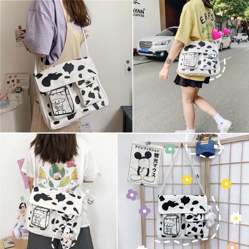 Túi đeo chéo họa tiết bò sữa thời trang cho nam và nữ kiểu mới có 3 ngăn và khoá kéo style KITI SHOP