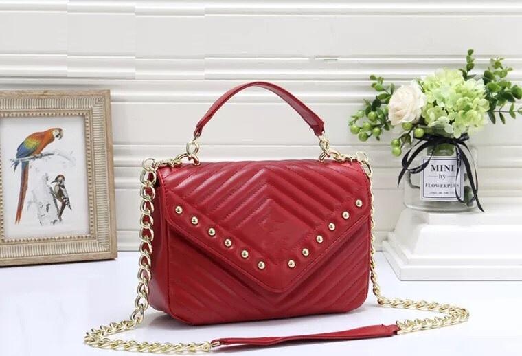 Túi xách tay nữ điệu đà da chần đính kim loại