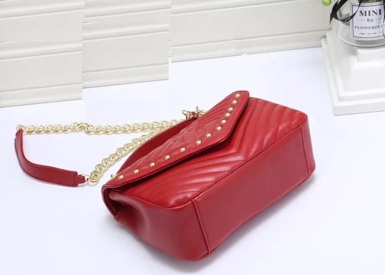 Túi xách tay nữ điệu đà da chần đính kim loại