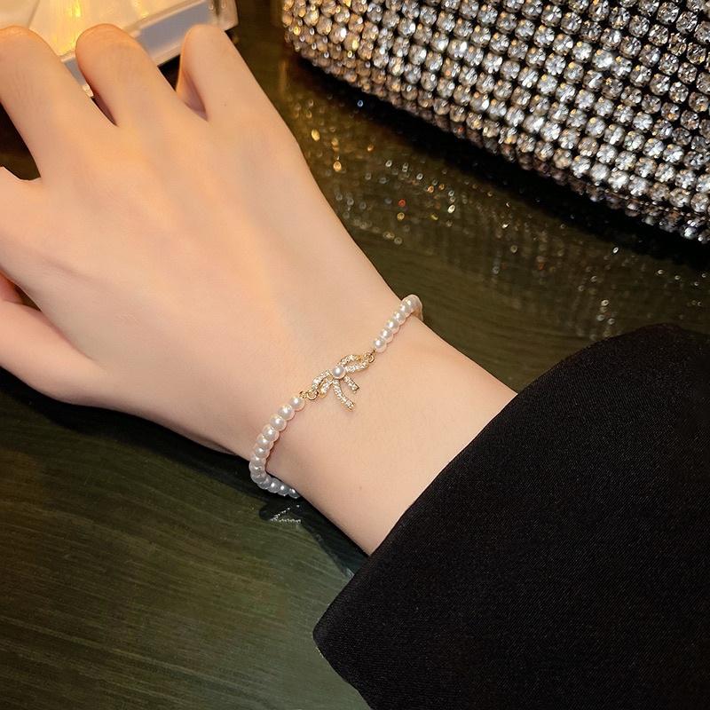 Lắc tay vòng tay nữ titan không gỉ mặt nơ phối hạt trai đẹp sang Ring House