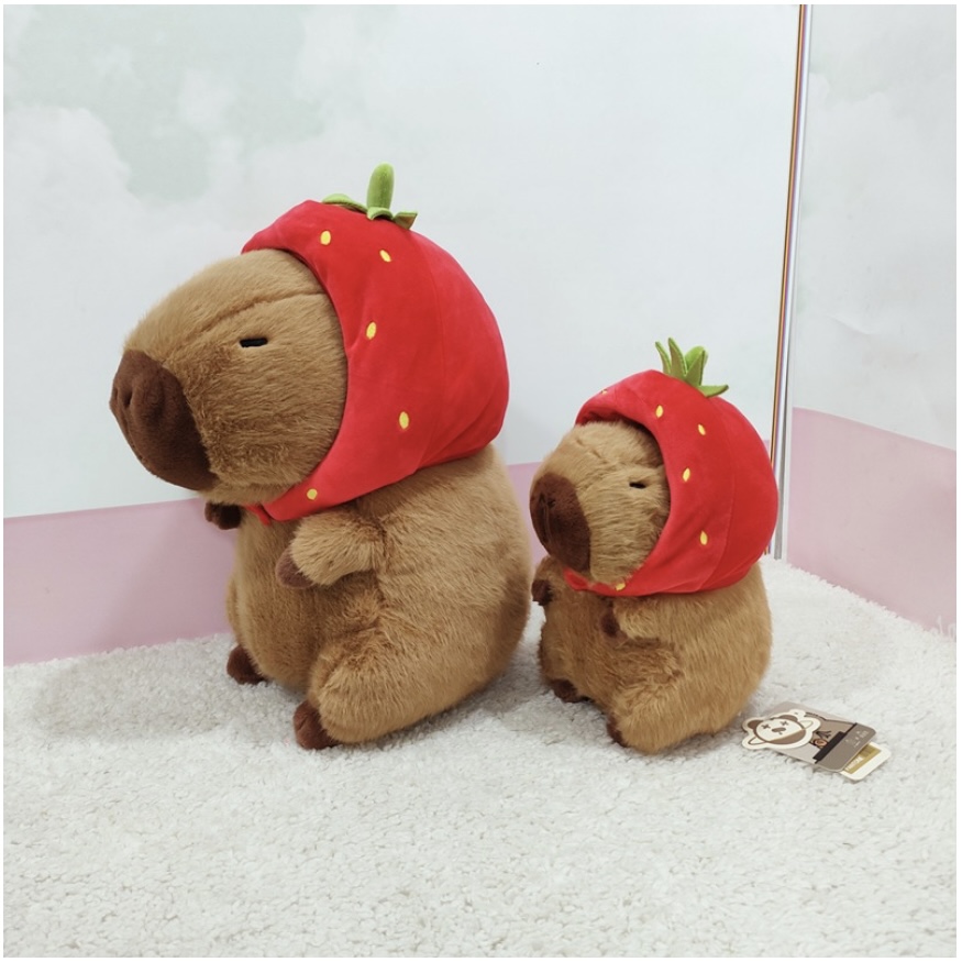 Thú nhồi bông capybara đội mũ dâu tây đáng yêu - Size từ 35cm đến 85cm - Quà tặng gấu bông capybara mang balô dâu tây trên lưng - Gối ôm chuột lang dễ thương cho bé