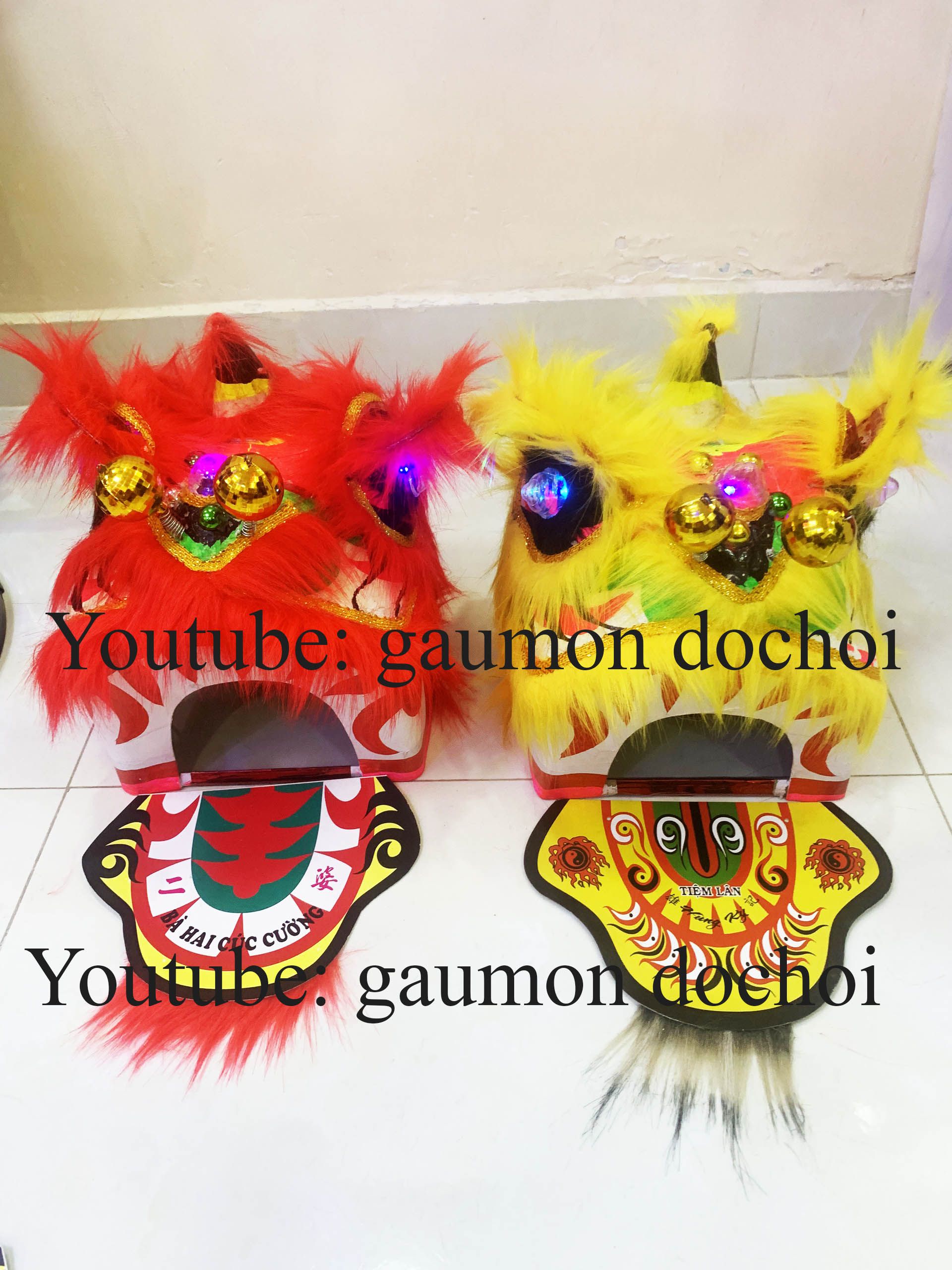 Đầu lân, sư tử, có đèn cử động chơp mắt rất đẹp, trông lân bằng da, đầu ông địa
